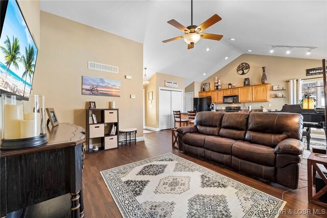 790 College Blvd, Osage Beach, MO 65065 - living area with a ceiling fan, high vaulted ceiling, dark wood-style flooring, and baseboards