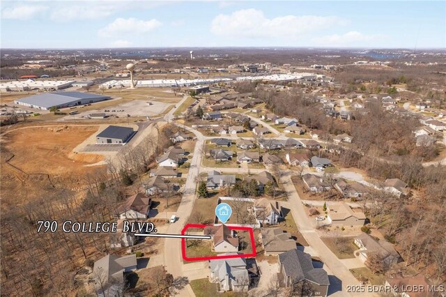 790 College Blvd, Osage Beach, MO 65065 - aerial view of property and surrounding area featuring property boundaries highlighted and nearby suburban area
