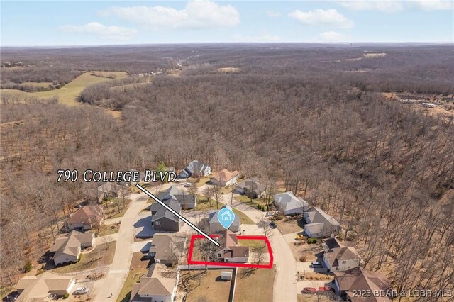 790 College Blvd, Osage Beach, MO 65065 - aerial view of residential area featuring property parcel outlined and a forest