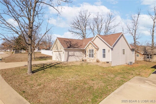 790 College Blvd, Osage Beach, MO 65065 - view of property exterior featuring driveway, an attached garage, a yard, and cooling unit