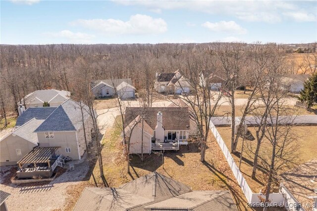 790 College Blvd, Osage Beach, MO 65065 - aerial perspective of suburban area featuring a heavily wooded area