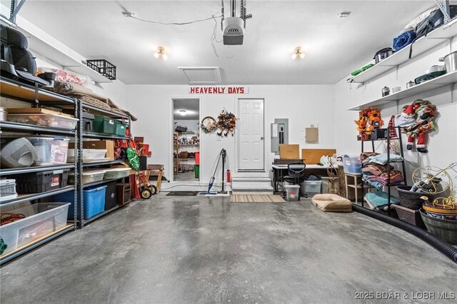 790 College Blvd, Osage Beach, MO 65065 - garage with a garage door opener and electric panel