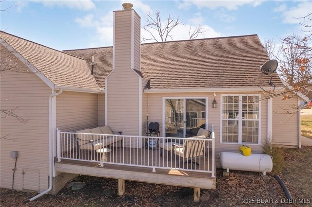 790 College Blvd, Osage Beach, MO 65065 - back of house with a deck, a chimney, and a shingled roof