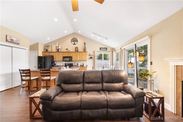 790 College Blvd, Osage Beach, MO 65065 - living area with dark wood-style floors, a ceiling fan, and high vaulted ceiling