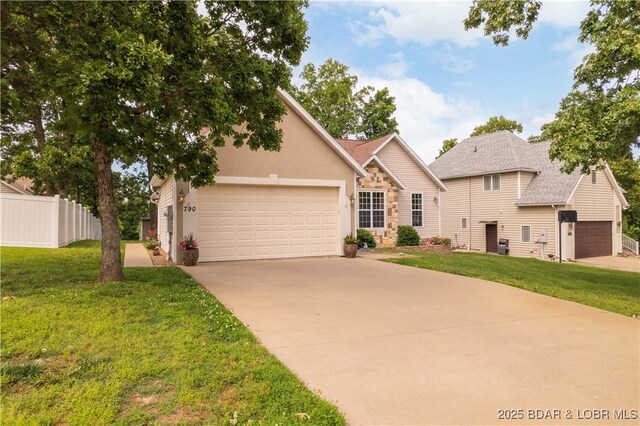790 College Blvd, Osage Beach, MO 65065 - view of front of home with stone siding, a garage, and concrete driveway