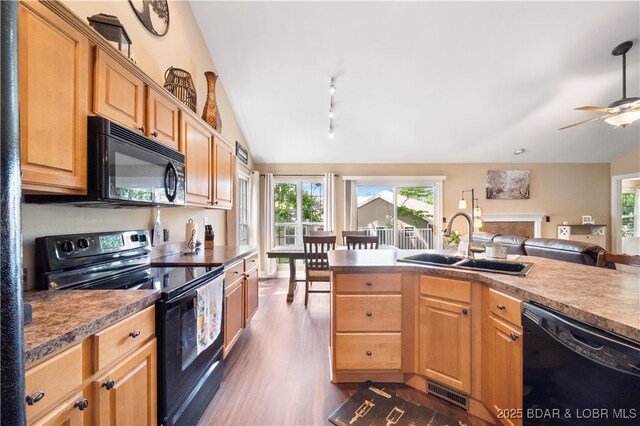 790 College Blvd, Osage Beach, MO 65065 - kitchen with black appliances, a sink, dark wood-style floors, light brown cabinetry, and a ceiling fan