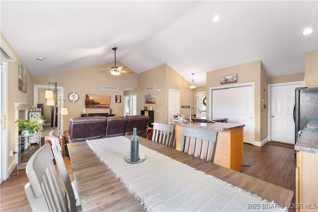 790 College Blvd, Osage Beach, MO 65065 - dining room with a ceiling fan, dark wood-style flooring, high vaulted ceiling, baseboards, and recessed lighting