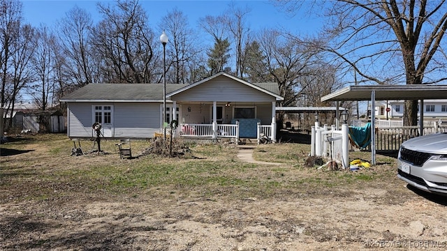 1501 Long Ln, Eldon, MO 65026 - view of front facade with a porch and a detached carport