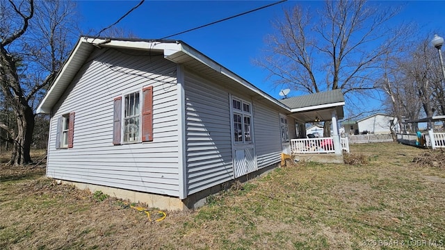 1501 Long Ln, Eldon, MO 65026 - view of property exterior with a porch and a lawn