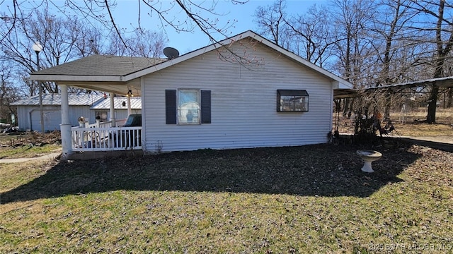1501 Long Ln, Eldon, MO 65026 - view of side of property featuring an outdoor structure and a yard