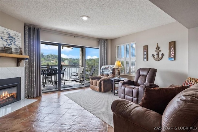 90 Falls Point Dr Unit 2C, Lake Ozark, MO 65049 - living room with a textured ceiling and a high end fireplace