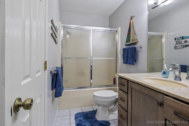90 Falls Point Dr Unit 2C, Lake Ozark, MO 65049 - bathroom with vanity, tile patterned floors, toilet, and enclosed tub / shower combo