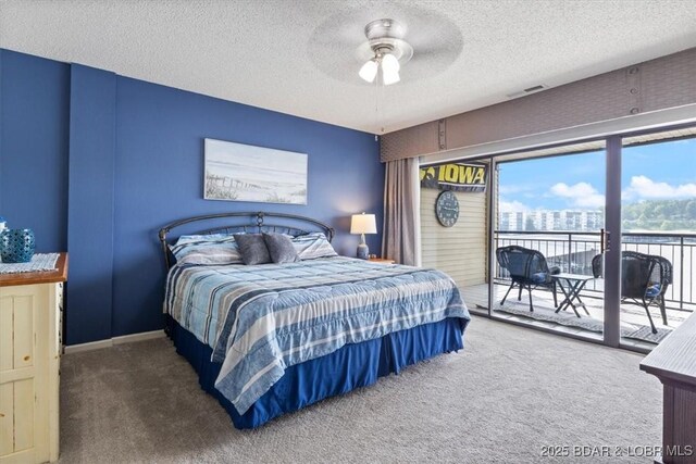 90 Falls Point Dr Unit 2C, Lake Ozark, MO 65049 - carpeted bedroom featuring access to outside, a textured ceiling, and a ceiling fan