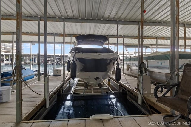 90 Falls Point Dr Unit 2C, Lake Ozark, MO 65049 - dock area featuring boat lift and a water view