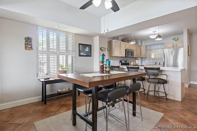 90 Falls Point Dr Unit 2C, Lake Ozark, MO 65049 - tiled dining room featuring baseboards and ceiling fan