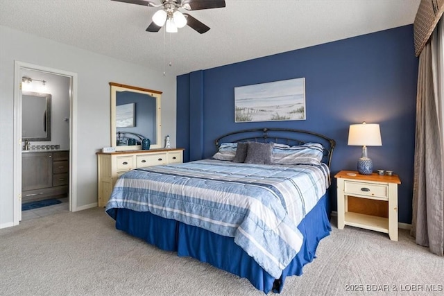 90 Falls Point Dr Unit 2C, Lake Ozark, MO 65049 - bedroom with carpet flooring, ensuite bath, baseboards, and a ceiling fan