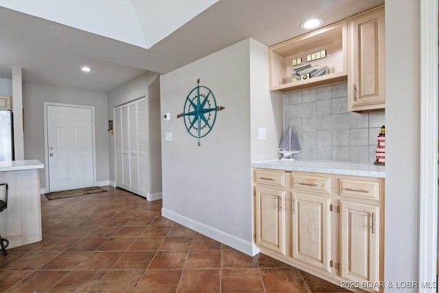 90 Falls Point Dr Unit 2C, Lake Ozark, MO 65049 - kitchen featuring white refrigerator, decorative backsplash, baseboards, recessed lighting, and light countertops