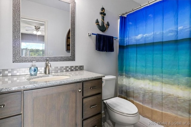 90 Falls Point Dr Unit 2C, Lake Ozark, MO 65049 - bathroom with toilet, vanity, a ceiling fan, and curtained shower