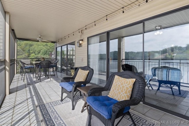 90 Falls Point Dr Unit 2C, Lake Ozark, MO 65049 - view of patio / terrace with ceiling fan, a water view, and outdoor dining space