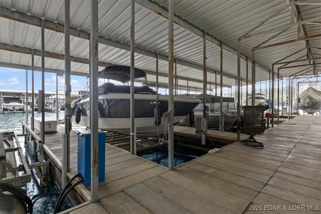 90 Falls Point Dr Unit 2C, Lake Ozark, MO 65049 - dock area with boat lift and a water view