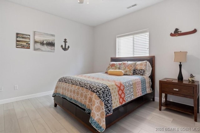 166 Oak Harbor Dr Unit 3D, Camdenton, MO 65020 - bedroom featuring wood finished floors and baseboards