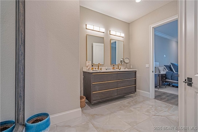 1184 Jeffries Rd Unit 310, Osage Beach, MO 65065 - full bathroom with double vanity, marble finish flooring, baseboards, and a textured wall