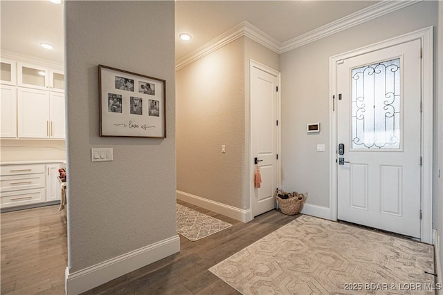 1184 Jeffries Rd Unit 310, Osage Beach, MO 65065 - foyer entrance with ornamental molding, wood finished floors, and baseboards