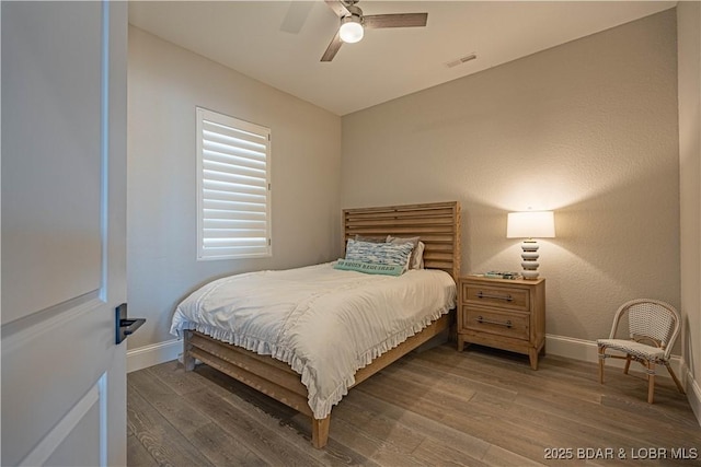 1184 Jeffries Rd Unit 310, Osage Beach, MO 65065 - bedroom with baseboards, wood finished floors, and ceiling fan