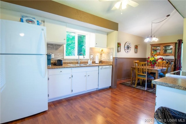 24 Canoe Ct, Osage Beach, MO 65065 - kitchen with white appliances, a sink, white cabinets, dark wood-style flooring, and wainscoting