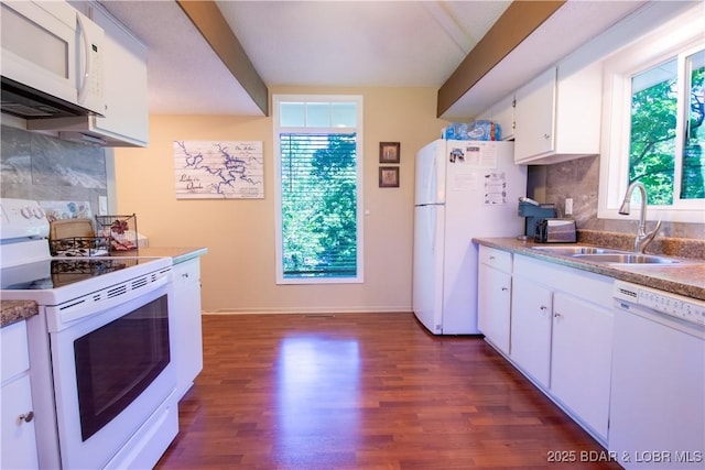 24 Canoe Ct, Osage Beach, MO 65065 - kitchen with white appliances, a sink, plenty of natural light, and dark wood-style flooring