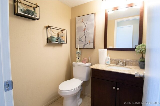 24 Canoe Ct, Osage Beach, MO 65065 - bathroom with vanity, toilet, tile patterned floors, and baseboards