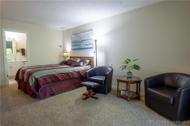 24 Canoe Ct, Osage Beach, MO 65065 - bedroom with carpet floors, a textured ceiling, and ensuite bath