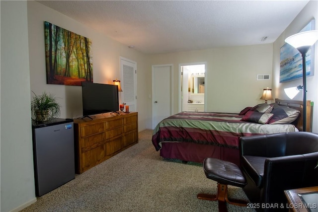 24 Canoe Ct, Osage Beach, MO 65065 - carpeted bedroom with fridge and connected bathroom