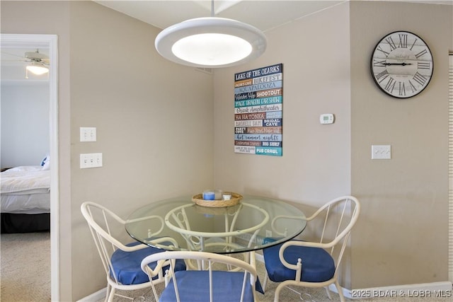 44 Emerald Bay Ct Unit 1B, Lake Ozark, MO 65049 - dining area featuring ceiling fan and carpet floors