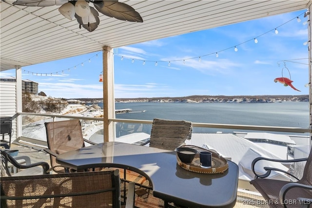 44 Emerald Bay Ct Unit 1B, Lake Ozark, MO 65049 - balcony with a water view, ceiling fan, and outdoor dining area