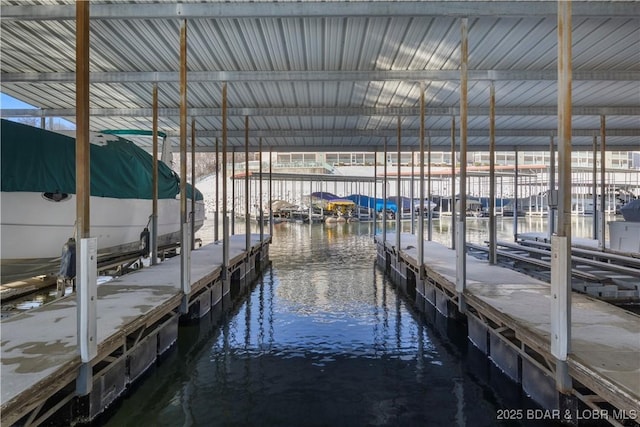 44 Emerald Bay Ct Unit 1B, Lake Ozark, MO 65049 - dock featuring a water view and boat lift