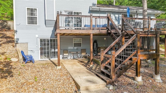 2195 Valley Rd, Osage Beach, MO 65065 - back of property featuring a wooden deck, a patio, and stairs