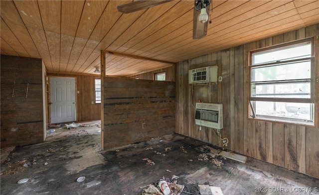 882 Wayne 459 Rd, Mo, MO 63957 - kitchen featuring heating unit, healthy amount of natural light, wooden ceiling, a wall mounted AC, and wood walls