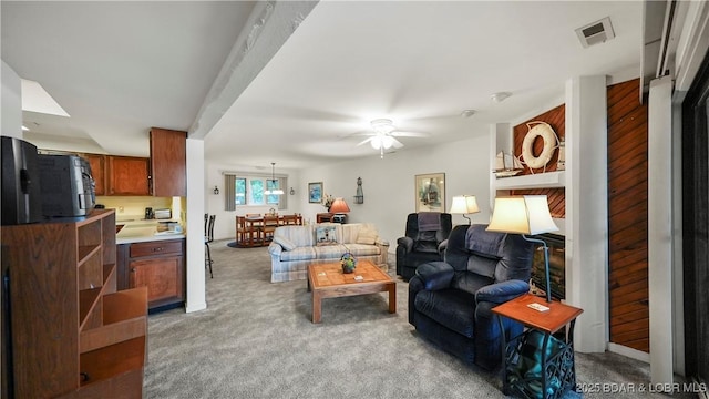 5940 Baydy Peak Rd Unit 325, Osage Beach, MO 65065 - living area featuring a ceiling fan and light carpet