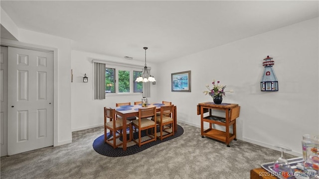 5940 Baydy Peak Rd Unit 325, Osage Beach, MO 65065 - dining room featuring carpet floors, a chandelier, and baseboards