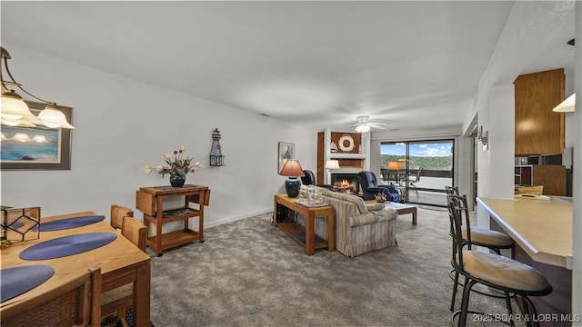 5940 Baydy Peak Rd Unit 325, Osage Beach, MO 65065 - carpeted living room featuring ceiling fan and a fireplace