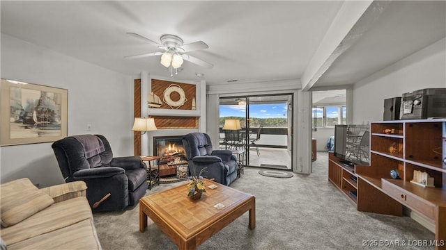 5940 Baydy Peak Rd Unit 325, Osage Beach, MO 65065 - carpeted living area featuring a large fireplace and a ceiling fan