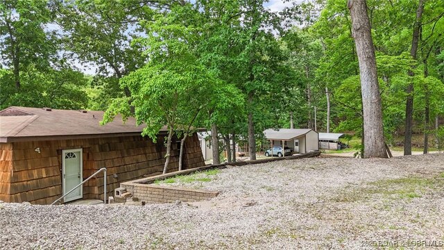 47 Dixie Ln, Sunrise Beach, MO 65079 - view of yard with gravel driveway