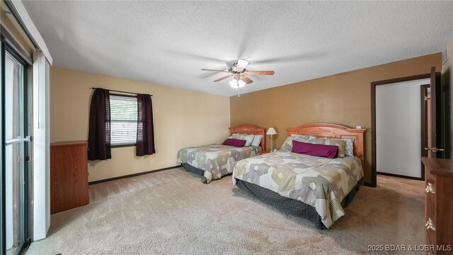 47 Dixie Ln, Sunrise Beach, MO 65079 - bedroom featuring carpet, a textured ceiling, a ceiling fan, and baseboards