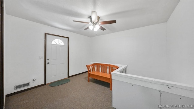47 Dixie Ln, Sunrise Beach, MO 65079 - unfurnished bedroom with carpet, baseboards, and ceiling fan