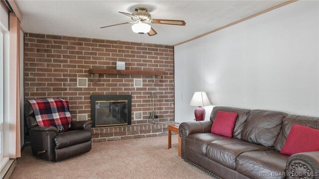 47 Dixie Ln, Sunrise Beach, MO 65079 - living room featuring a ceiling fan, carpet floors, crown molding, and a brick fireplace