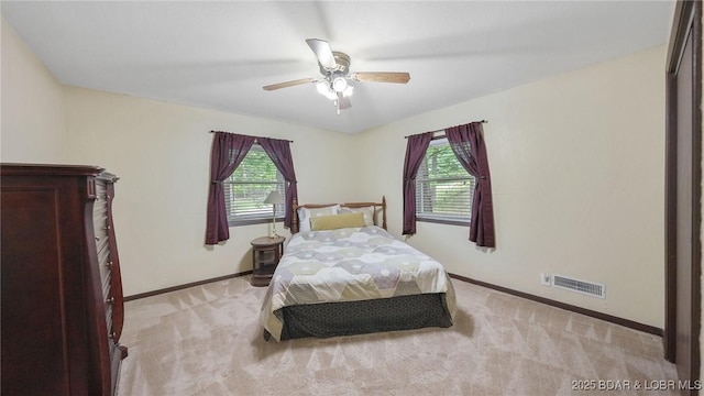 47 Dixie Ln, Sunrise Beach, MO 65079 - bedroom with multiple windows, baseboards, and light colored carpet