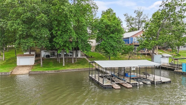 47 Dixie Ln, Sunrise Beach, MO 65079 - dock with a water view, a lawn, and boat lift