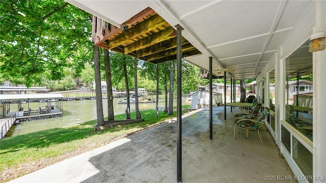 47 Dixie Ln, Sunrise Beach, MO 65079 - view of patio with a water view and a boat dock