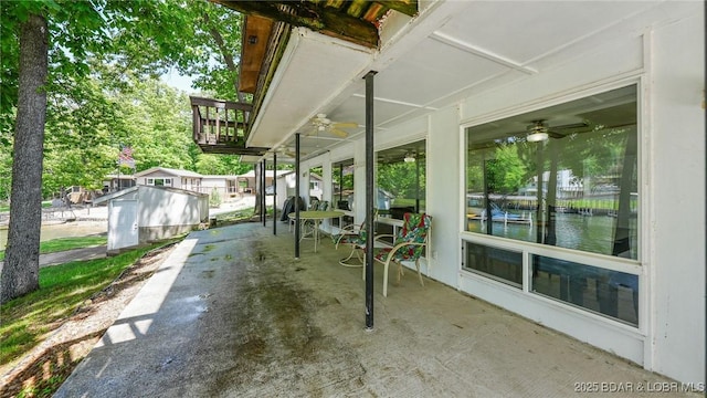 47 Dixie Ln, Sunrise Beach, MO 65079 - view of patio / terrace with a water view and ceiling fan